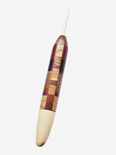 Wooden crochet hook with a square patchwork pattern on a white background