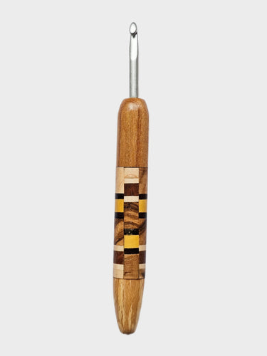 Wooden-handled crochet hook on a gray background