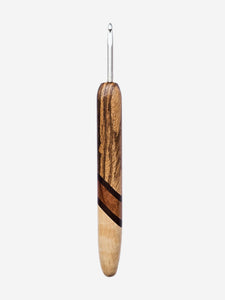 Wooden-handled crochet hook on a light gray background