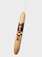 Wooden crochet hook with a white background