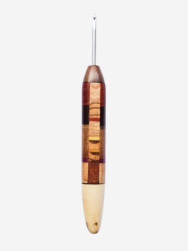 Wooden crochet hook with a square patchwork pattern on a white background