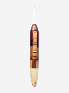 Wooden crochet hook with a square patchwork pattern on a white background