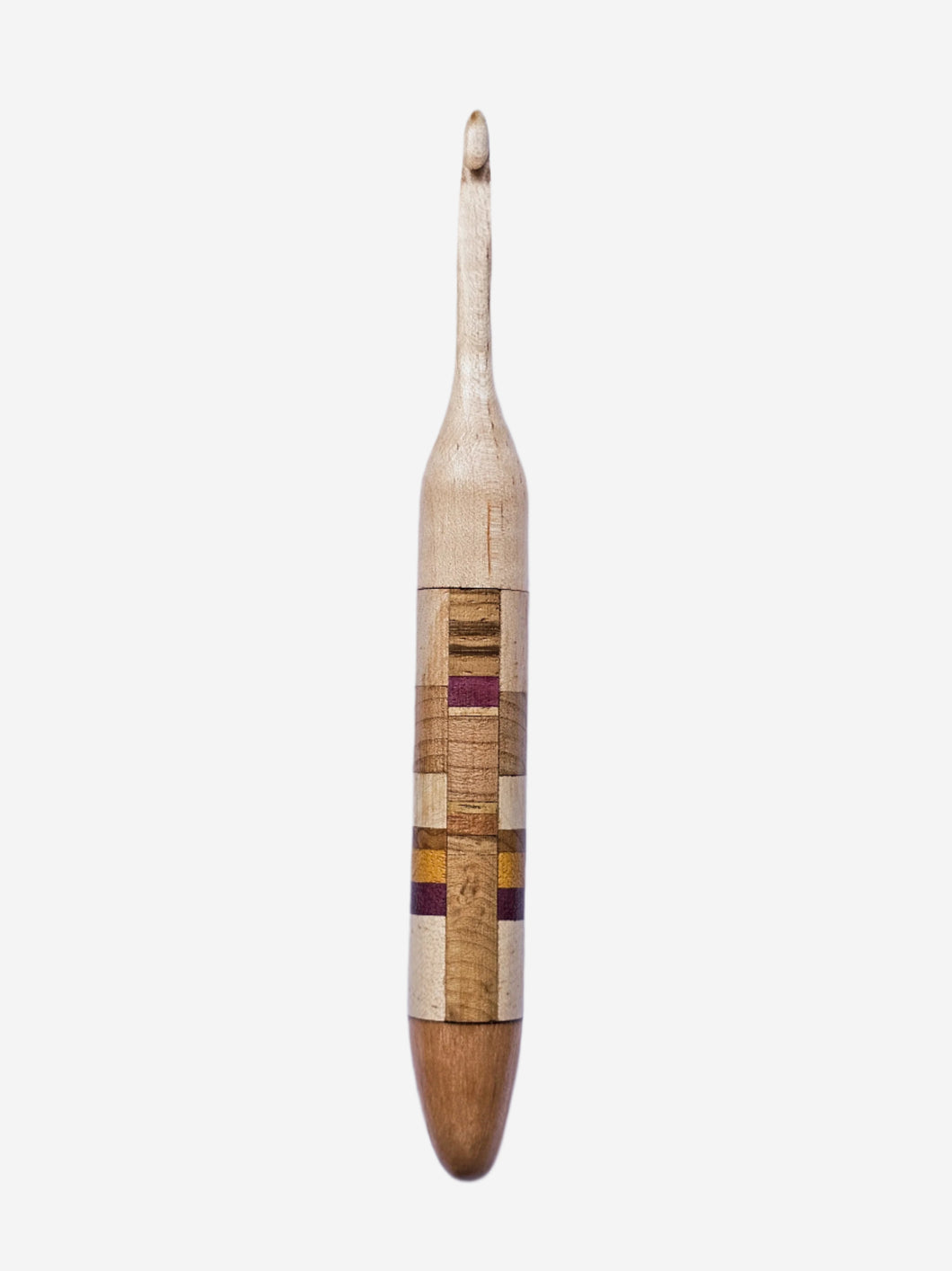 Wooden crochet hook with a patterned handle on a light gray background